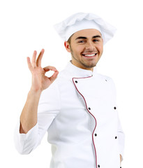 Professional chef in white uniform and hat, isolated on white