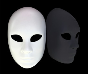 White mask with reflection on black background