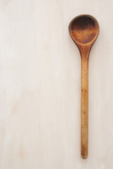 wooden spoon on textured background