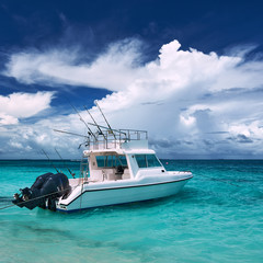 Fototapeta na wymiar Beautiful island beach with motor boat