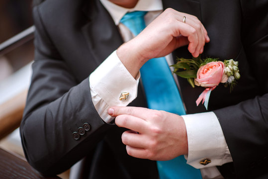 groom with flowers