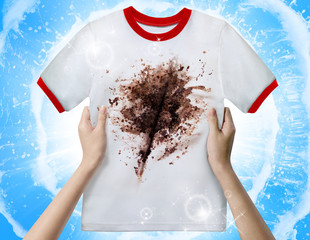 Hands holding a dirty shirt