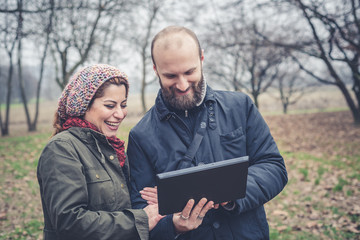 couple in love using tablet connecting web wireless wifi