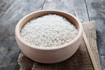 Fototapeta na wymiar rice in wooden bowl
