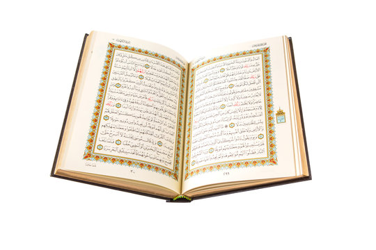 The Holy Quran over white background