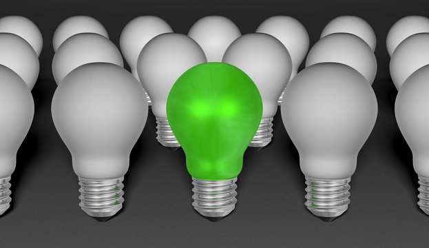 One green light bulb among grey ones on grey background