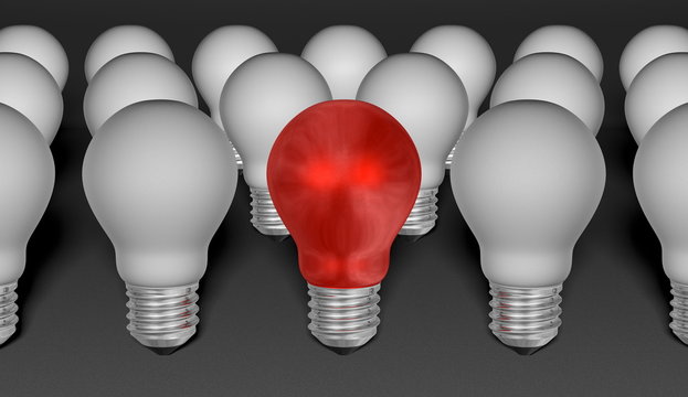 One red light bulb among grey ones on grey background