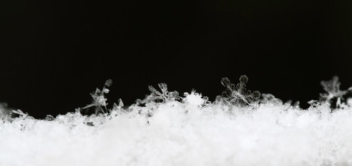 Snowflake in white snow - 60878345