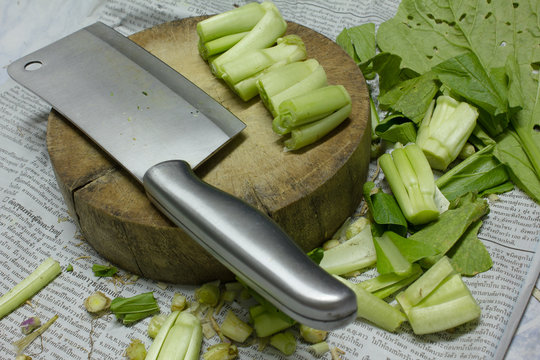 Chopping Block, Kitchen Knife And Vegetables