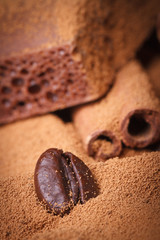 Coffee bean in the ground coffee on a background of chocolate