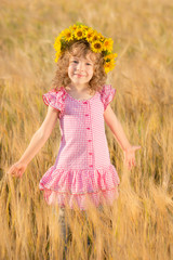 Happy child in wheat field