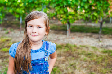 Summer portrait of a beautiful little girl