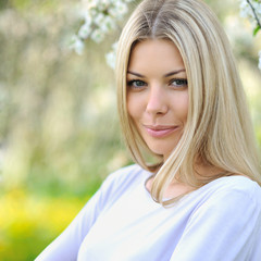 Portrait of a beautiful young caucasian blonde woman outdoor