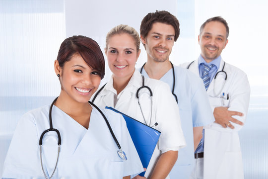 Group of doctors standing together over white