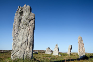 Standing stones against a blue sky