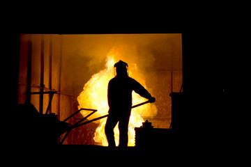 Hard work in a foundry, melting iron