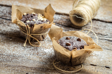Closeup of decorating sweet muffins with string