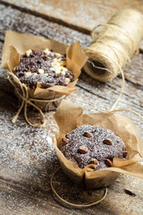 Closeup of decorating chocolate muffins