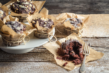 Tasting freshly baked chocolate muffins.