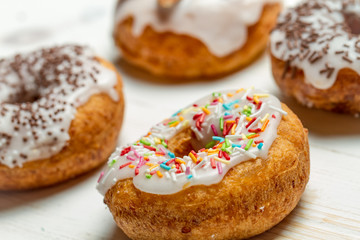 Freshly baked donuts with sprinkles