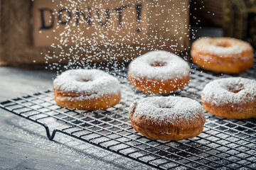 Falling powder sugar on donuts