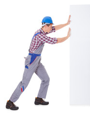 Young Male Worker Pushing Placard