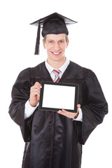 Man In Graduation Robe Showing Tablet Pc