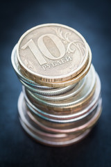 Pile of russian coins on a dark background. Selective focus.
