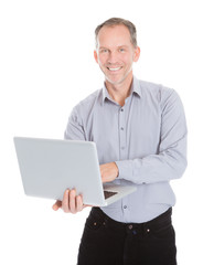 Happy Businessman Holding Laptop