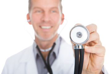 Portrait Of Male Doctor Examining