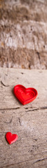 Love of red hearts on wooden background