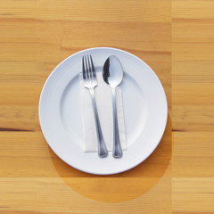 Fork and spoon and plate