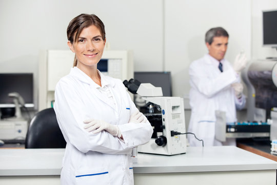 Confident Female Scientist In Laboratory