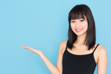 attractive asian woman on blue background