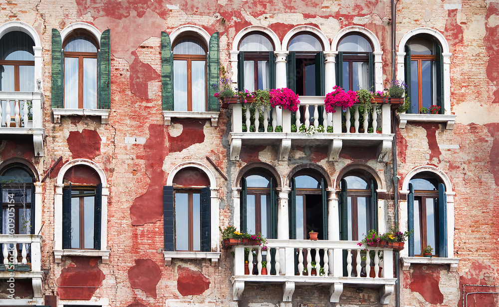 Wall mural typical venice facade with balconies and flowers.