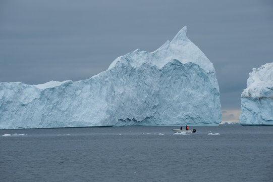 Fisherman's boat and icebergs in Greenland