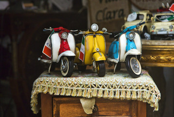 Close-up of toy scooters for sale