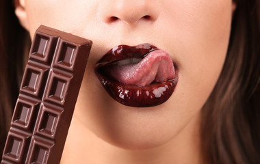 Closeup of female lips in chocolate