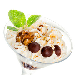 Bright colored dessert decorated with walnut