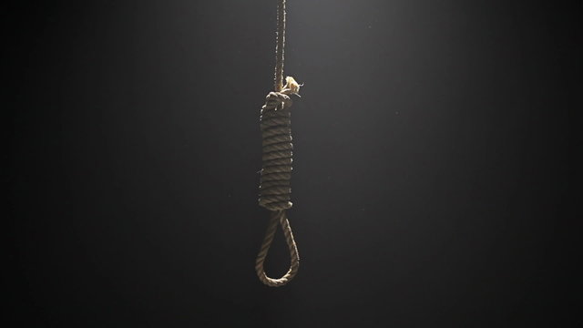 Falling Hangman Noose over black background