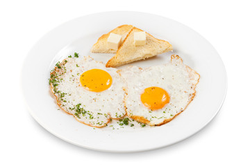 fried eggs on a white plate