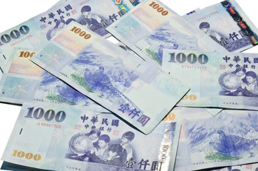 A lot of 1000 New Taiwan Dollars bill on white background