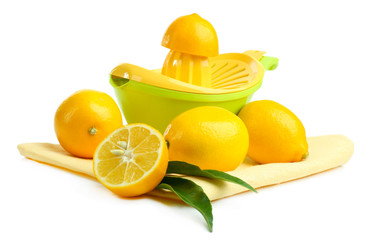 Citrus press and lemons isolated on white