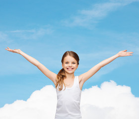 smiling teenage girl with raised hands