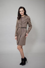 Beautiful young woman in autumn coat