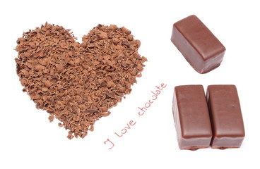 Heart shaped grated chocolate and three candies