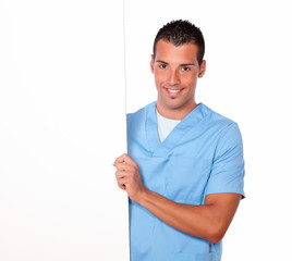 Latin nurse guy holding a white placard