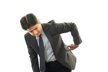 腰痛を訴えるビジネスマン