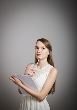 Girl in white. Concentration.