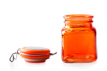 Empty orange glass jar